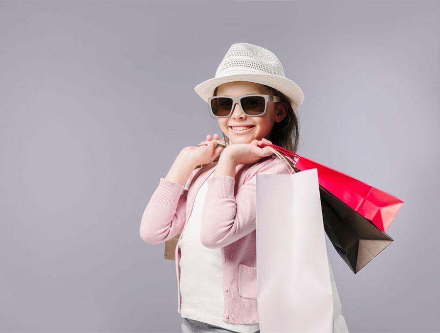 Smiling shopper holding bags